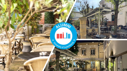 alumni logo over a courtyard picture